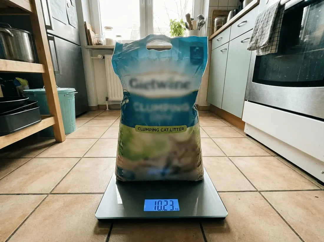 A 10 kg bag of clumping litter on a scale