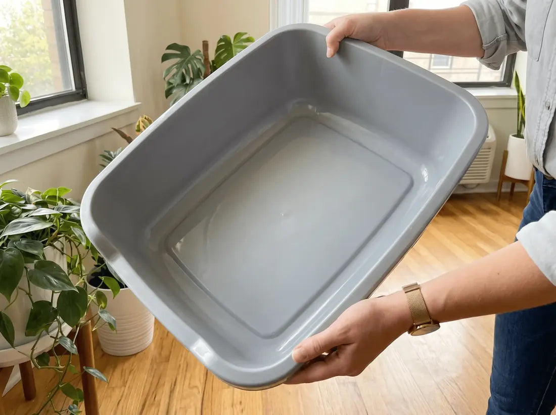 An empty litter tray with a perfectly clean base — no marks, no crusted residue